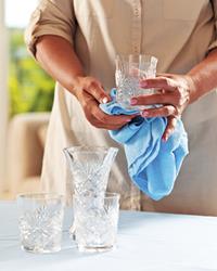 woman cleaning crystal